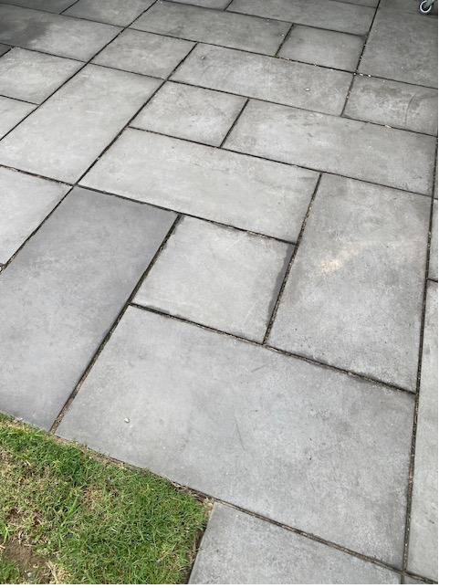 A patio of large-format pavers combined into a pattern