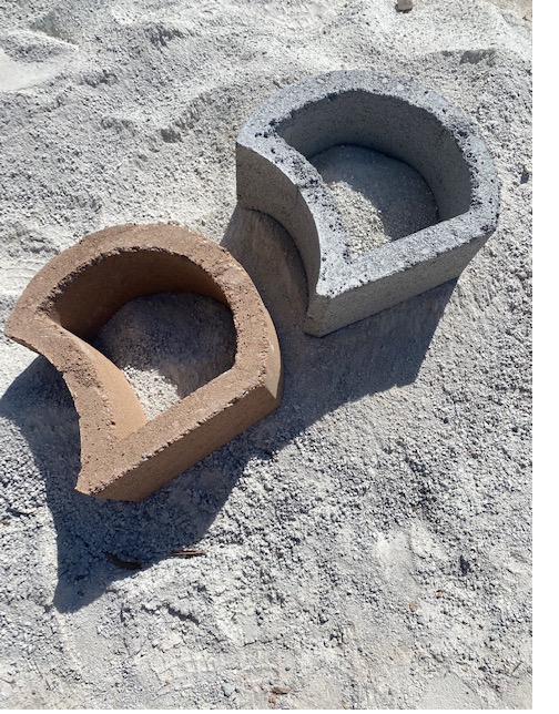 Two retaining blocks, one earthy and one cement