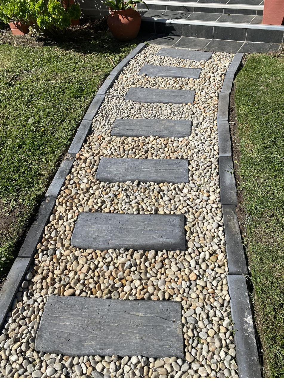 Modern smooth garden edging beside a path