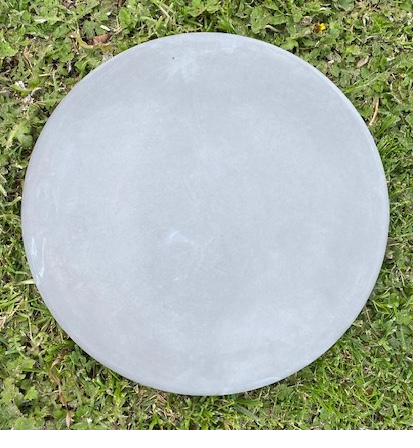 A 450 mm round smooth paver on grass